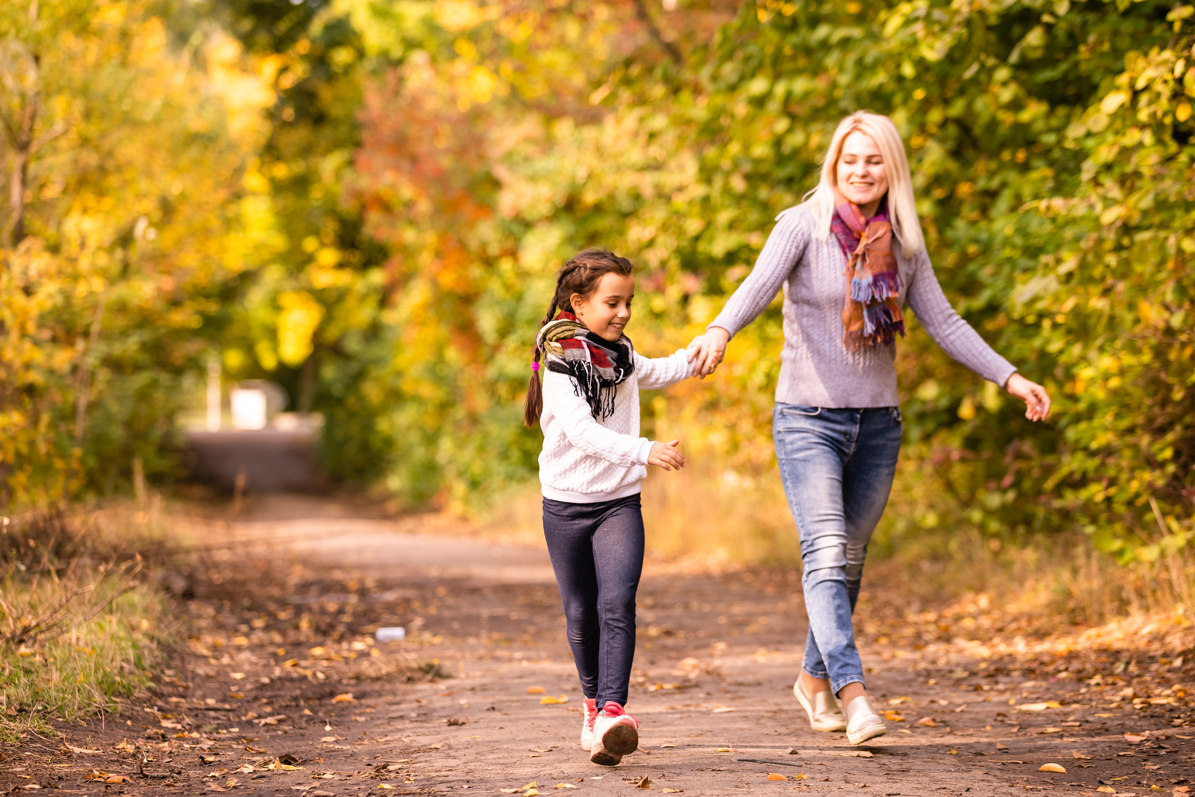 Mom with her daughter during autumn